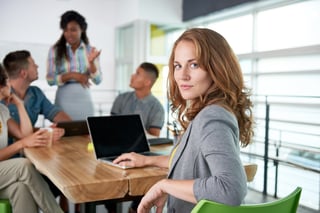 Image of a medical team and  woman using laptop during meeting.jpeg